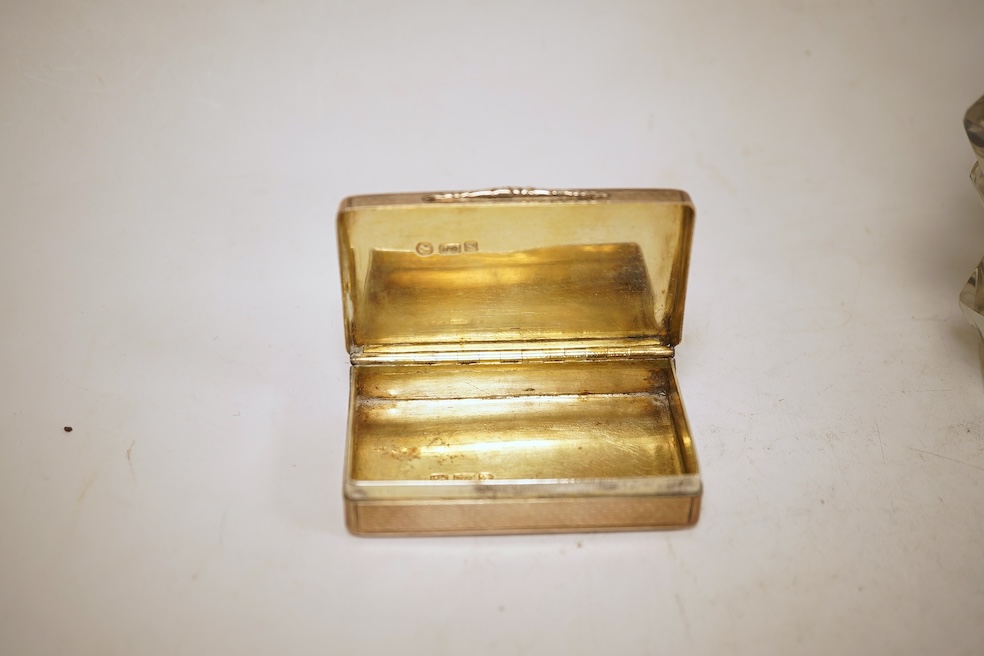 A Victorian engraved silver snuff box, Yapp & Woodward, Birmingham, 1899, 68mm, a small silver scent bottle and two silver-mounted glass scent bottles.